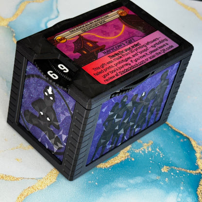 The Gaang bulkheads for Universal DeckDock – purple glitter panels with black silhouettes, shown on a deck box